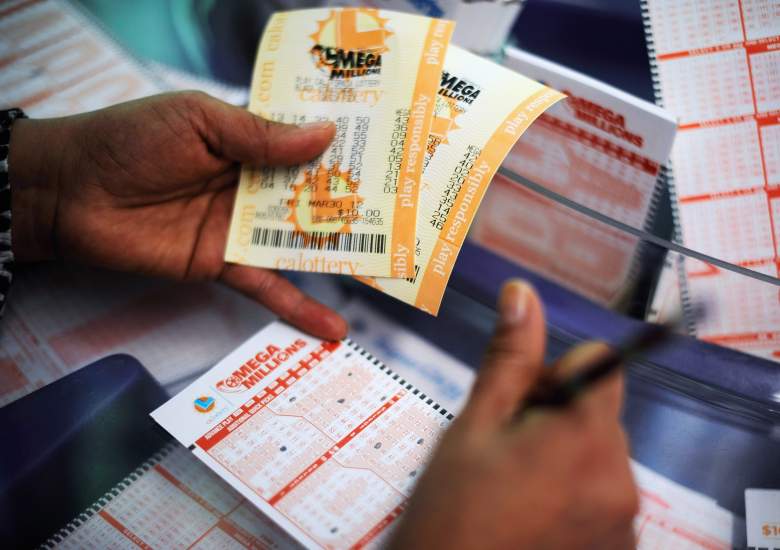 COVINA, CA - MARCH 30: A woman fills out a Mega Millions lottery ticket form at Liquorland on March 30, 2012 in Covina, California The Mega Millions jackpot has reached a high of $640 million before the drawing tonight. (Photo by Kevork Djansezian/Getty Images)