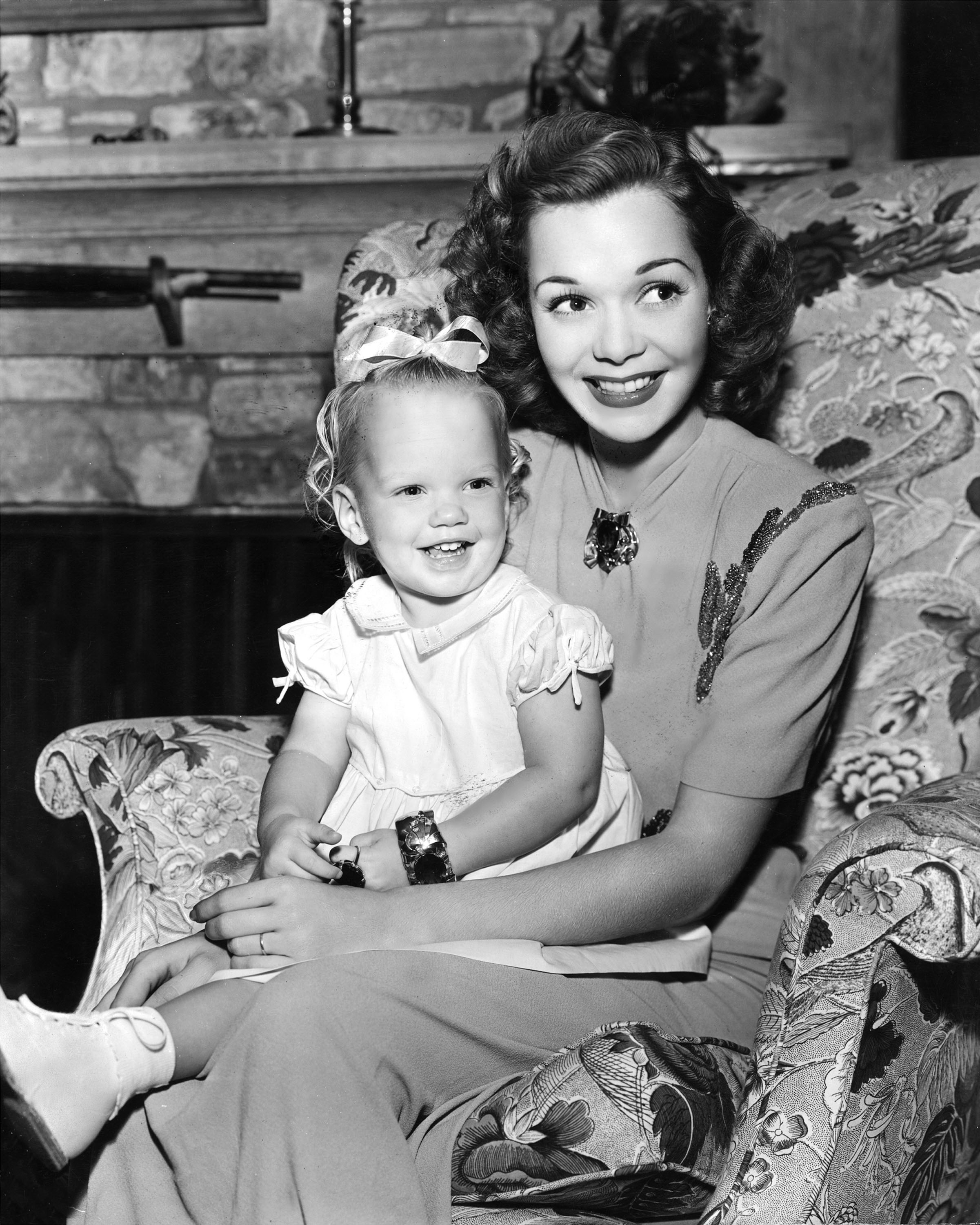 American actress Jane Wyman holds her infant daughter Maureen Reagan on her lap in an undated photo.  (Mark Wilson/Getty)