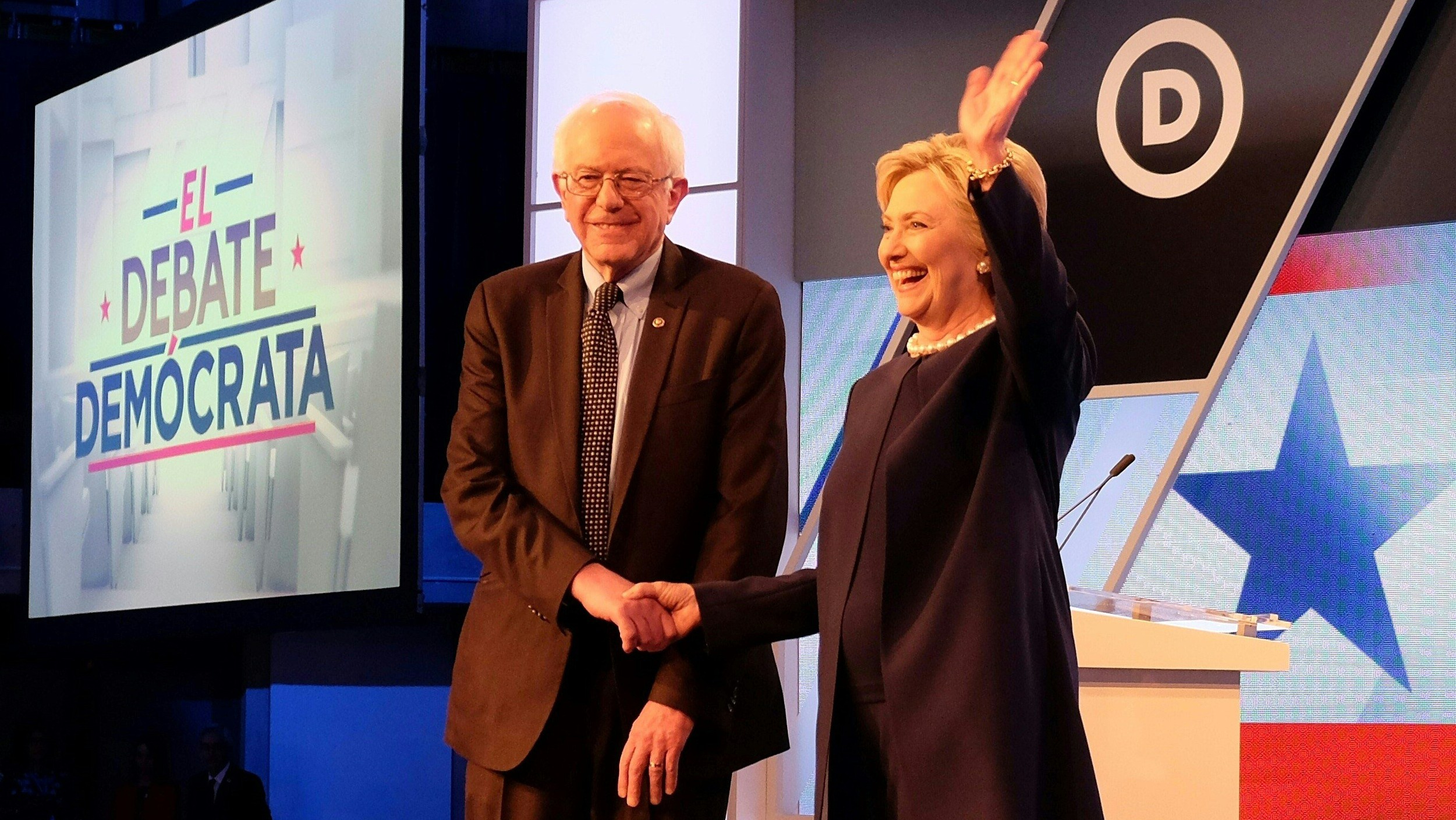 Democratic presidential candidates Hillary Clinton and Bernie Sanders shake hands before their debate at Miami Dade College in Miami on March 9, 2016. (Getty)