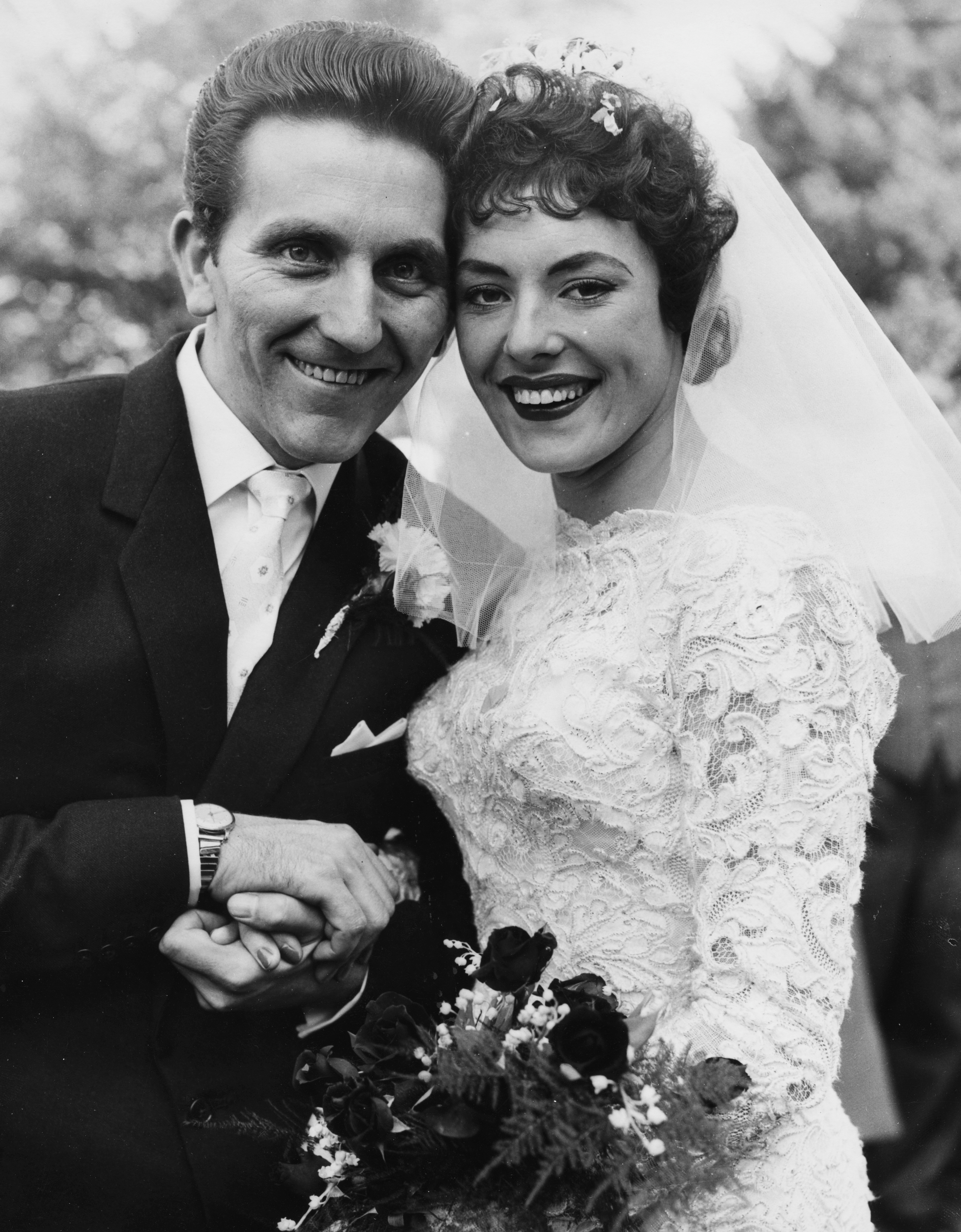 Singer and comedienne Anne Hart and her groom John Padley on their wedding day, at Holy Trinity Church, Wallington, Surrey, October 15th 1957. (Getty)