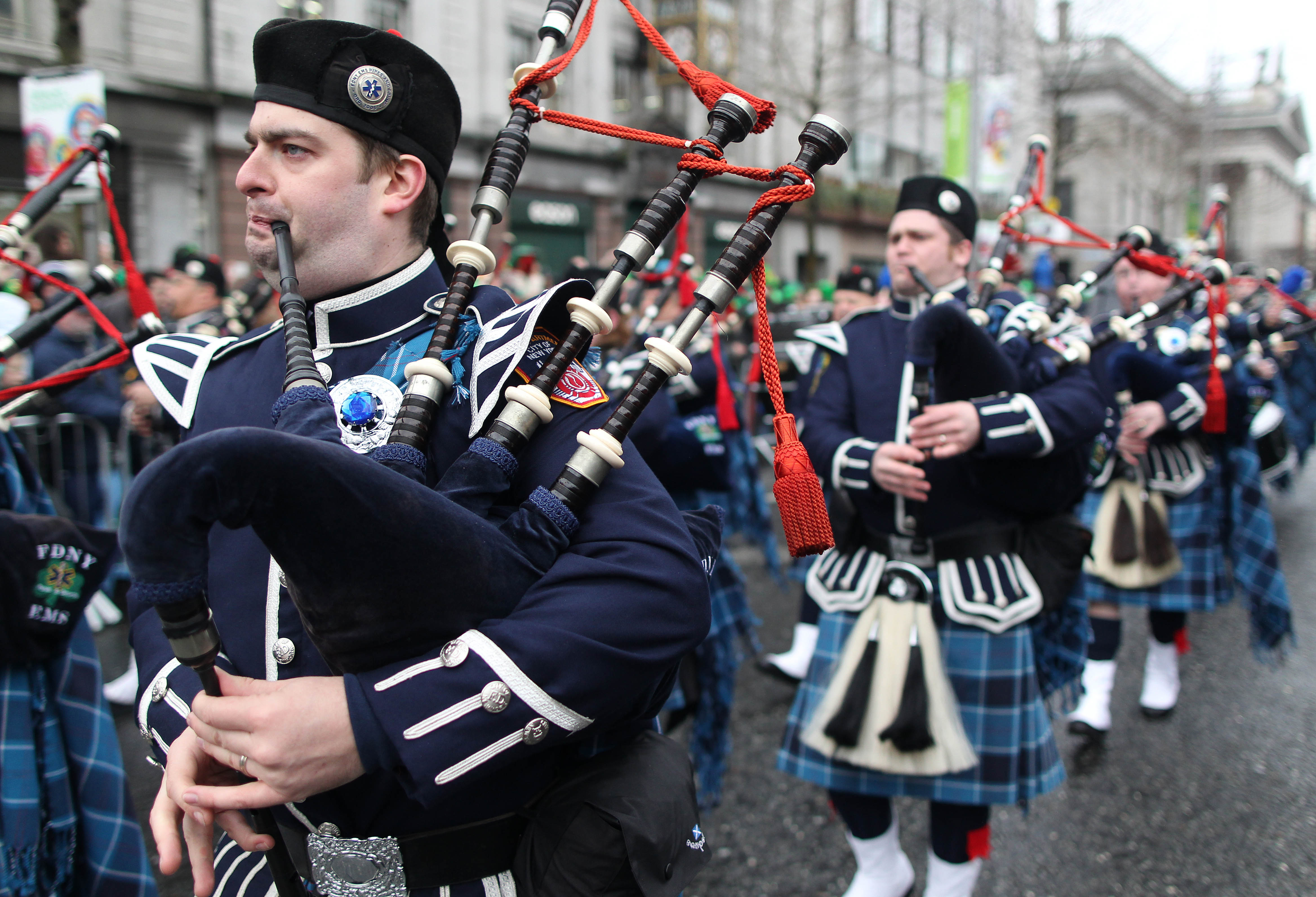 Members of the New York City Fire department play the bagpipes on the parade route during St Patrick's Day festivities in Dublin on March 17, 2013. (Getty)