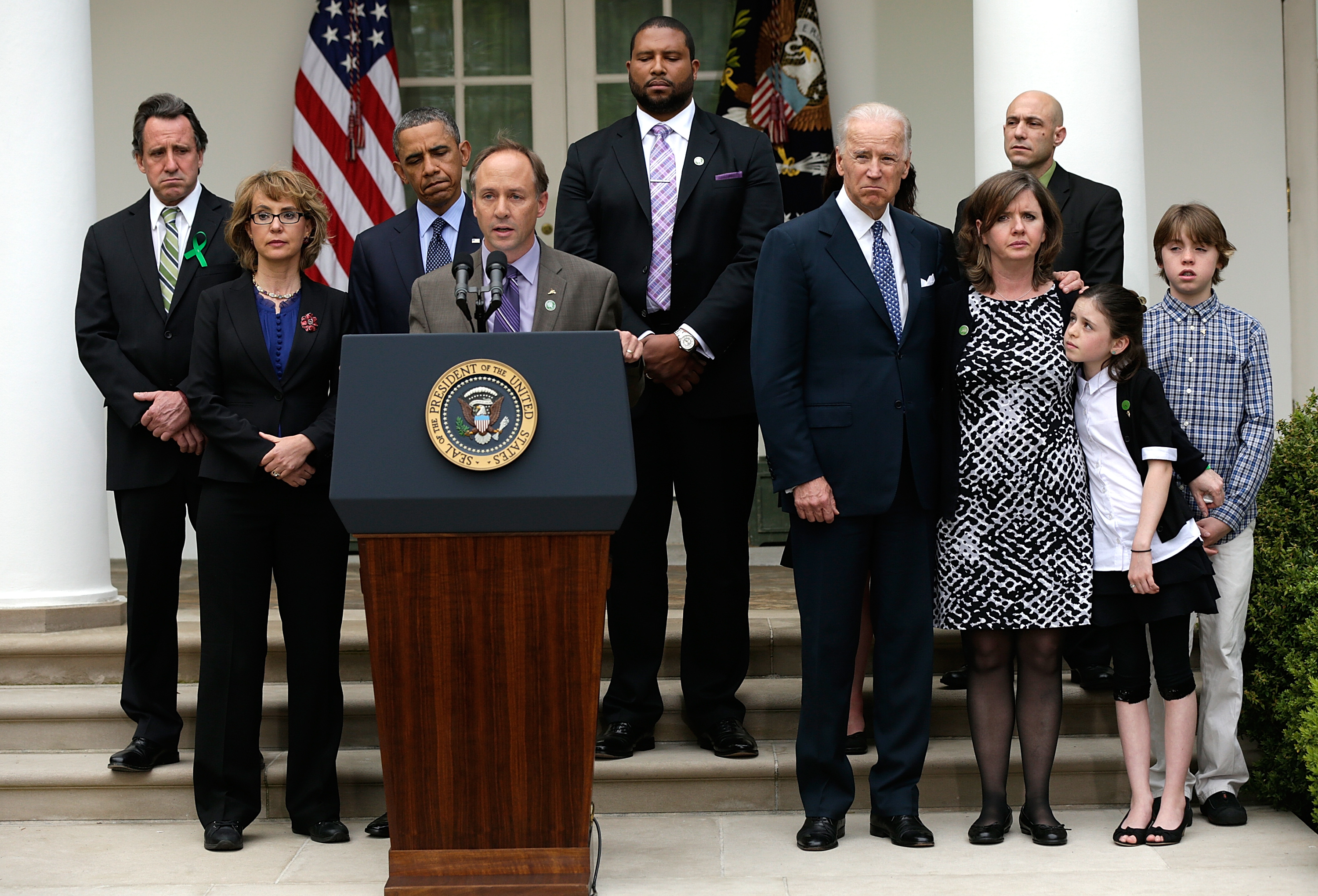 Mark Barden, the father of a victim at Sandy Hook Elementary School, joins U.S. President Barack Obama and Vice President Joe Biden in making a statement on gun violence in the Rose Garden of the White House on April 17, 2013 in Washington, DC. . Also pictured are family members of gun violence victims, and victims of gun violence, Gabby Giffords, Jimmy Greene, Nicole Hockley, Jeremy Richman, Neil Heslin, Jackie Barden, Natalie Barden and James Barden.  (Getty)