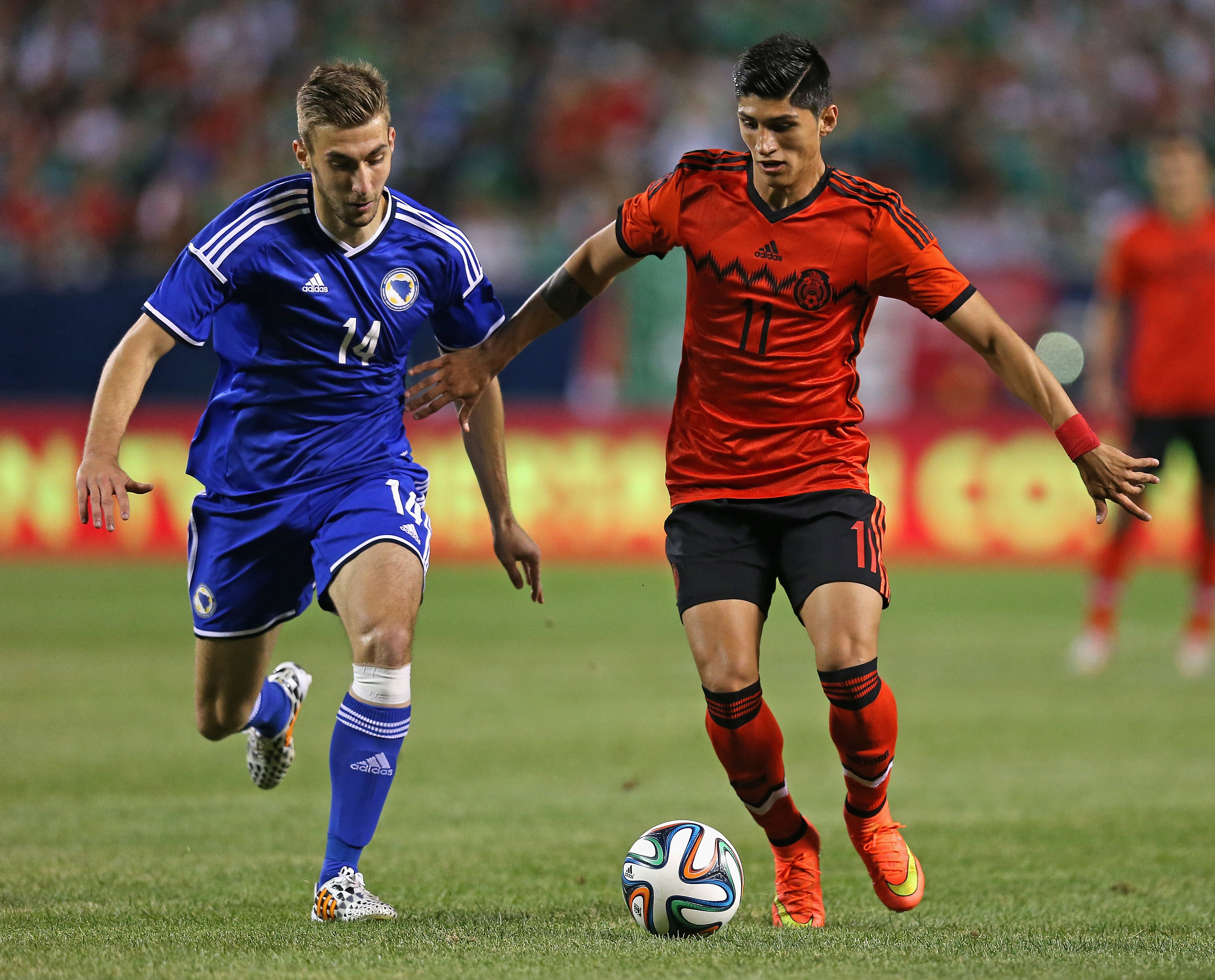 Alan Pulido, in red. (Getty)