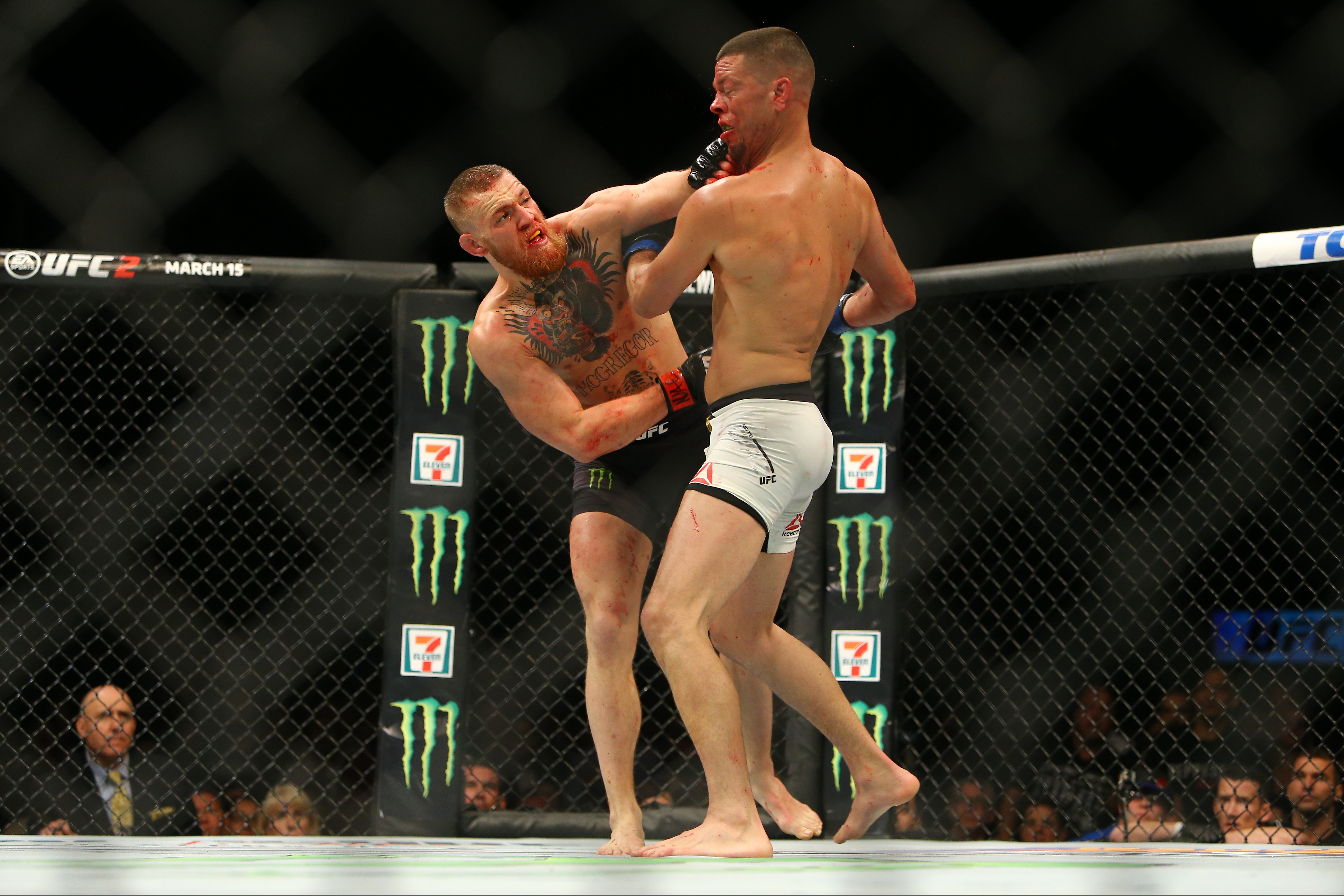 Conor McGregor punches Nate Diaz during UFC 196 at the MGM Grand Garden Arena on March 5, 2016 in Las Vegas, Nevada. (Getty)