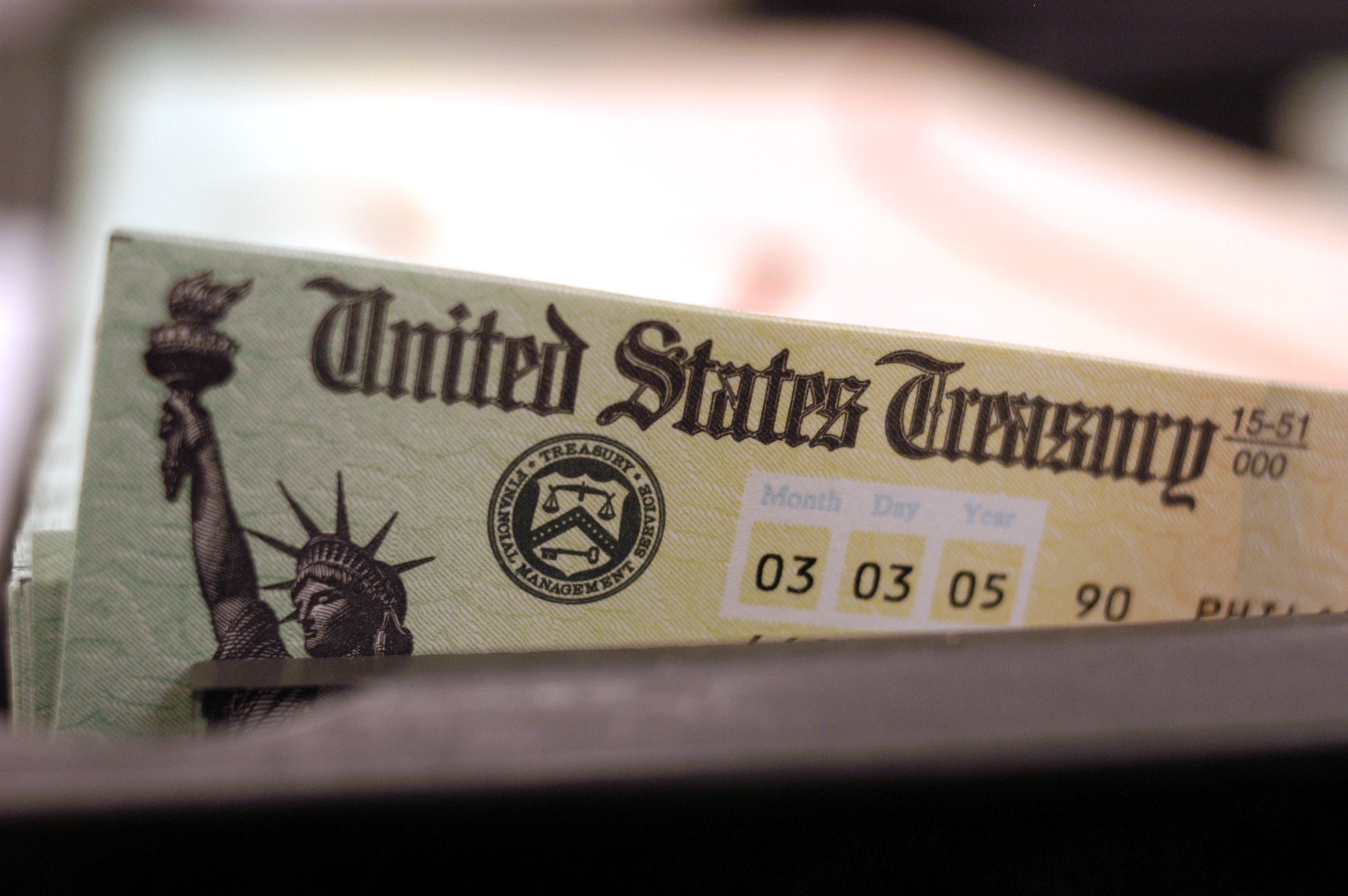 Blank Social Security checks are run through a printer at the U.S. Treasury printing facility. (Getty)