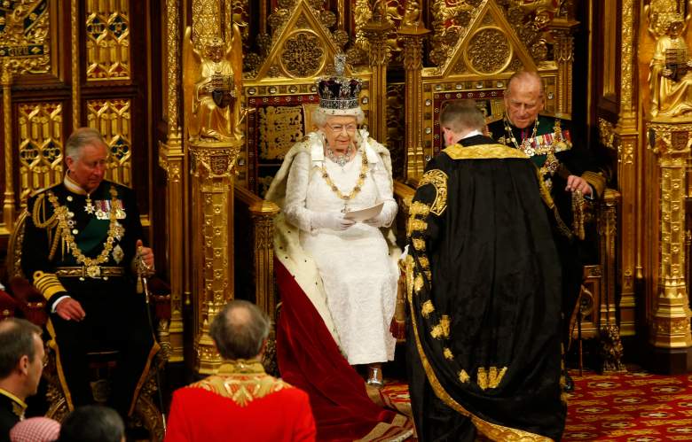LONDON, ENGLAND - MAY 18:  Queen Elizabeth II accepts the Queen's Speech from the Lord Chancellor Michael Gove as Prince Philip, Duke of Edinburgh looks on during State Opening of Parliament in the House of Lords at the Palace of Westminster on May 18, 2016 in London, England. The State Opening of Parliament is the formal start of the parliamentary year. This year's Queen's Speech, setting out the government's agenda for the coming session, is expected to outline policy on prison reform, tuition fee rises and reveal the potential site of a UK spaceport. (Photo by Alastair Grant - WPA Pool/Getty Images)