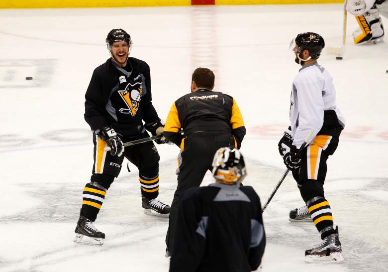 Sidney Crosby jokes with Eric Fehr during the Stanley Cup Final Media Day. (Getty)