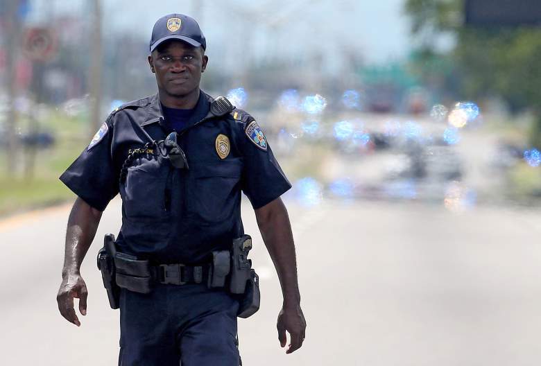 BATON ROUGE, LA - JULY 17: Baton Rouge Police officers patrol Airline Hwy after 3 police officers were killed early this morning on July 17, 2016 in Baton Rouge, Louisiana. According to reports, one suspect has been killed while others are still being sought by police. (Photo by Sean Gardner/Getty Images)