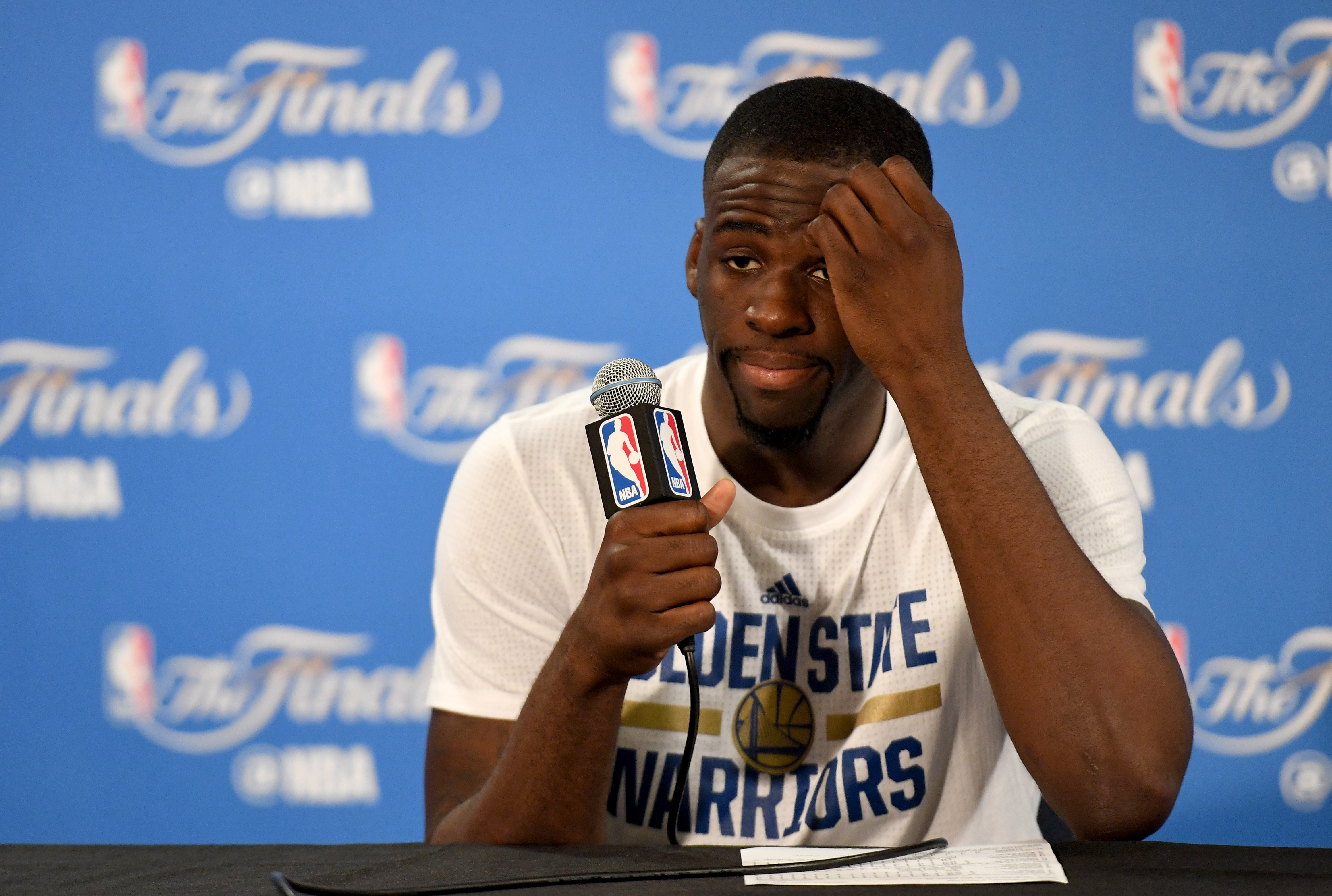 Draymond Green of the Golden State Warriors speaks to members of the media after being defeated by the Cleveland Cavaliers in Game 7 of the 2016 NBA Finals at ORACLE Arena on June 19, 2016 in Oakland, California. (Getty)