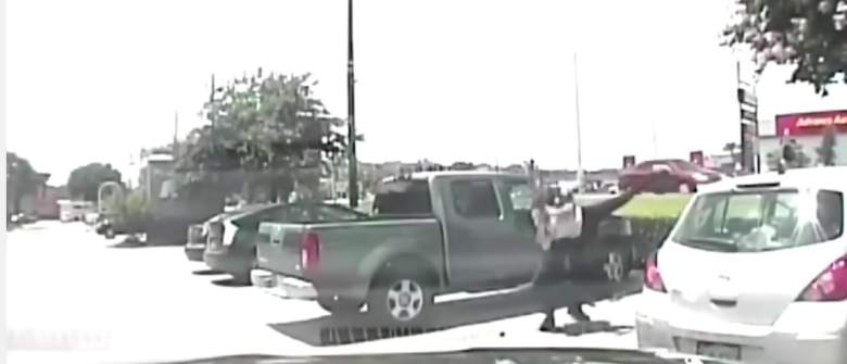 A screenshot from the police video of the Austin teacher being thrown to the ground by a police officer. (YouTube)