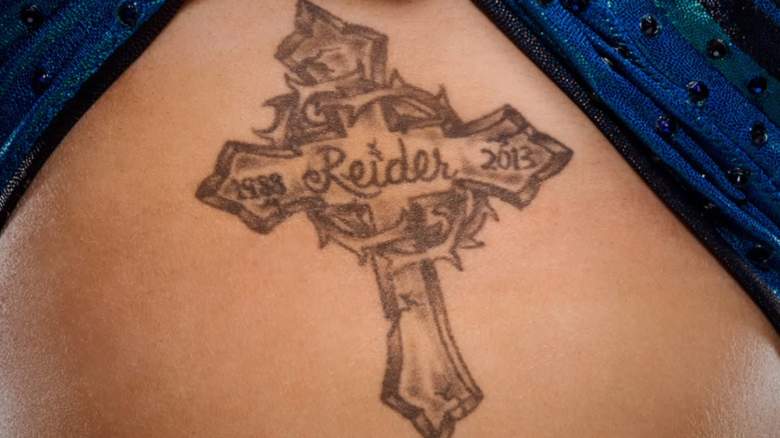 WWE Charlotte Tattoo, WWE Charlotte cross tattoo, wwe charlotte tattoo meaning