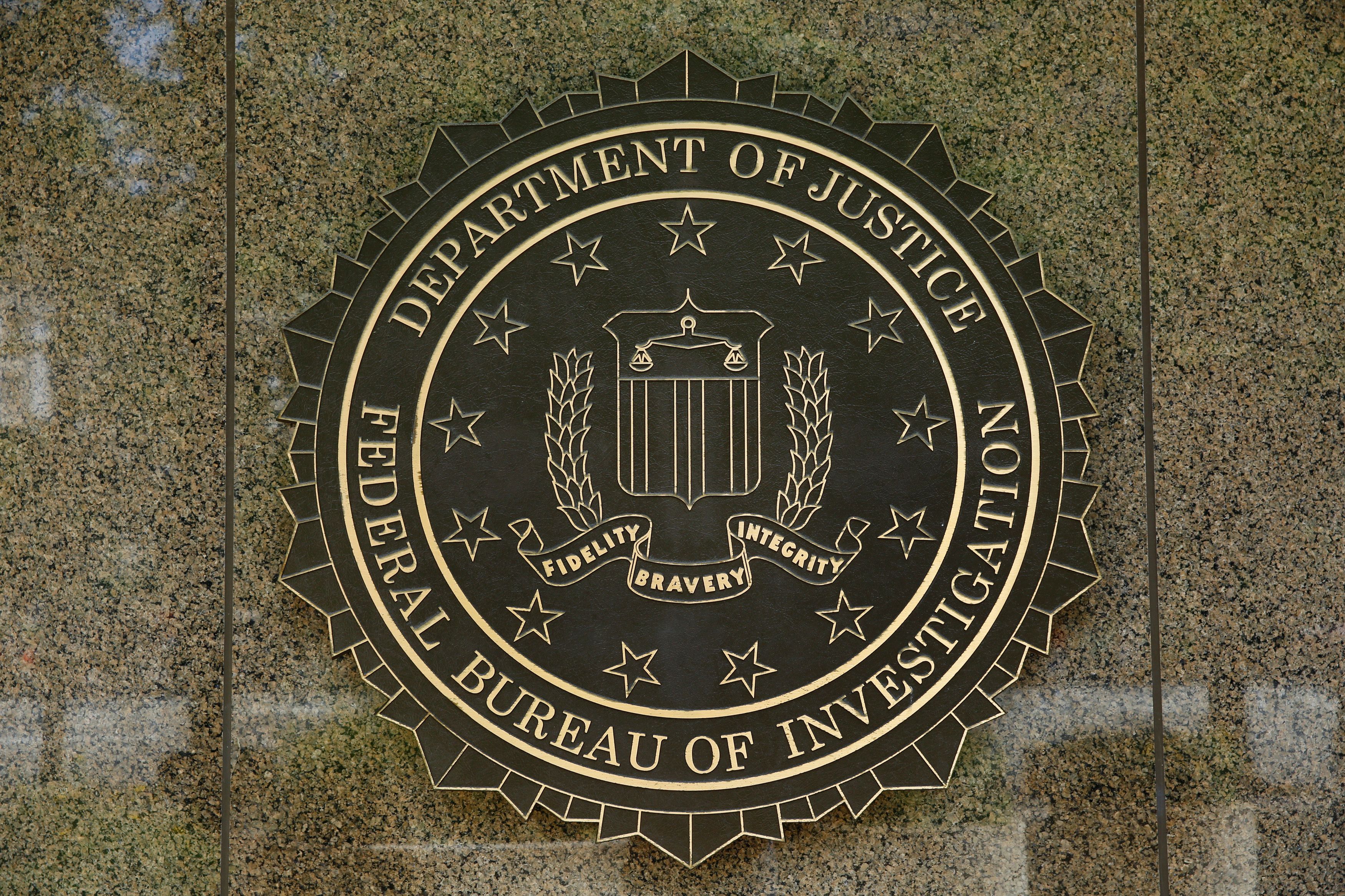 The FBI logo is seen outside the headquarters building in Washington, DC on July 5, 2016. (Getty)