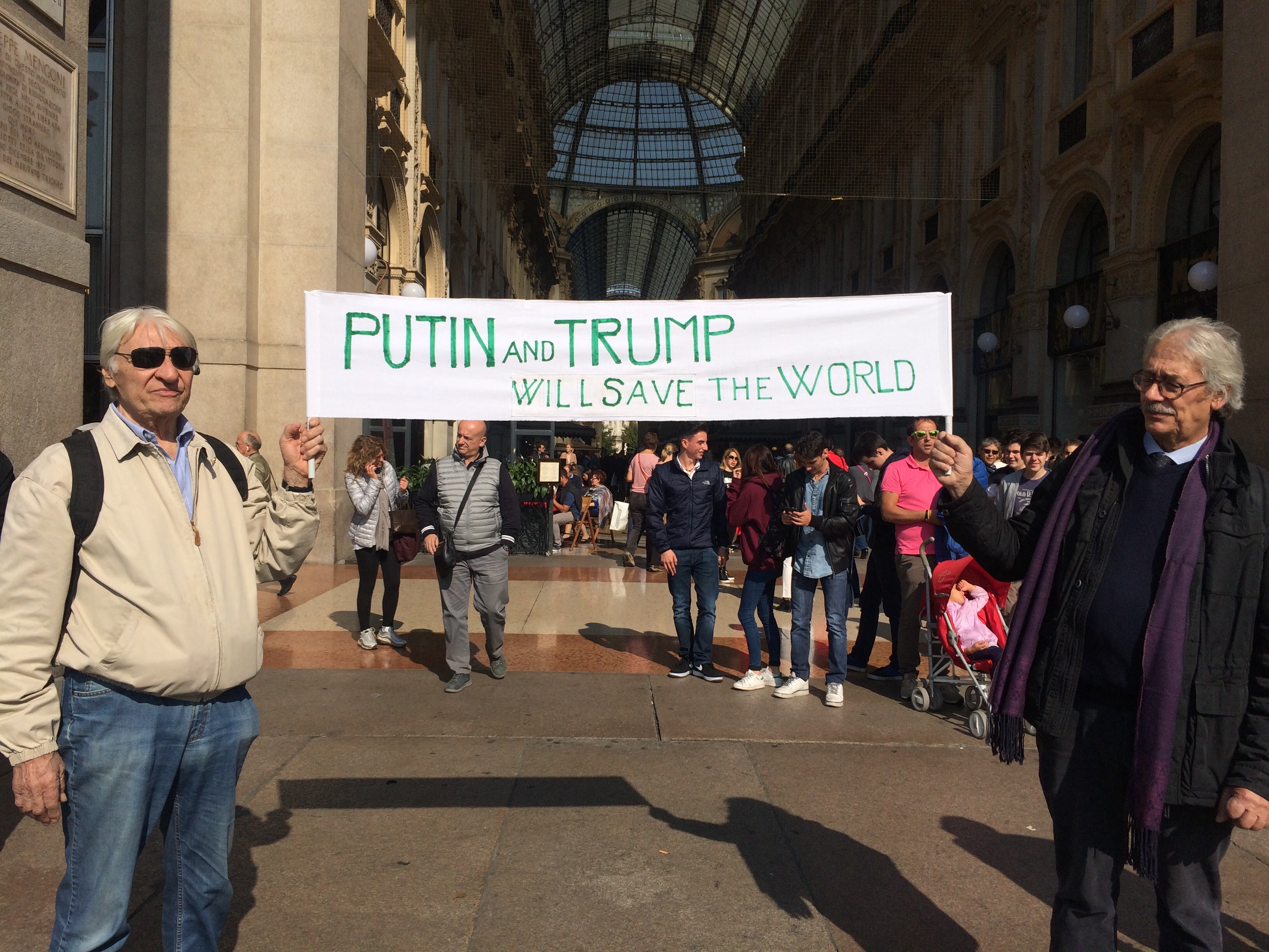 Vladimir Putin and Donald Trump supporters are seen on October 7, 2016 in Milan, Italy. (Getty)