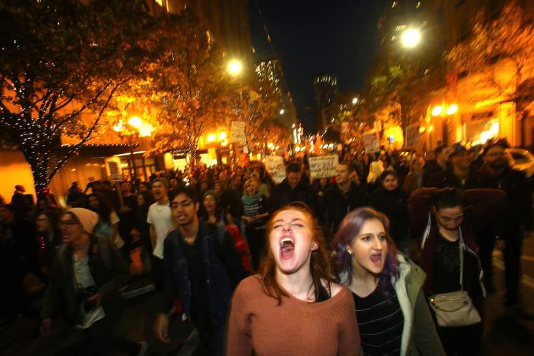 SEATTLE, WA - NOVEMBER 09: Sasha Savenko (C) and Sydney Kane (C, Right), both students at the University of Washington, join thousands of protesters march down 2nd Avenue on November 9, 2016 in Seattle, Washington. Demostrations in multiple cities around the country were held the day following Donald Trump's upset win in last night's U.S. presidential election. (Photo by Karen Ducey/Getty Images)