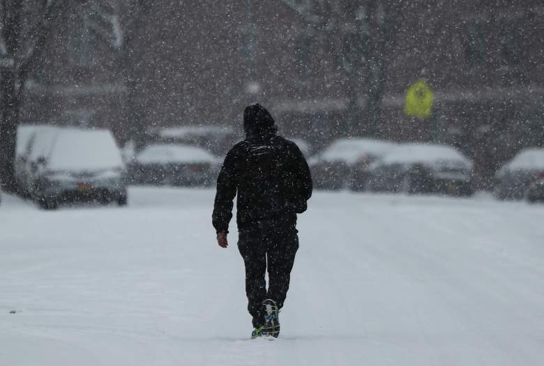 NEW YORK, NY - DECEMBER 17: A man walks through the snow along a Brooklyn street on December 17, 2016 in the Brooklyn borough of New York City. New York City saw the first snow accumulation of the season on Saturday morning. (Photo by Spencer Platt/Getty Images)