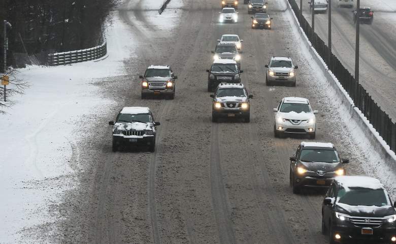 NEW YORK, NY - DECEMBER 17: Cars travel through the snow and ice along a Brooklyn highway on December 17, 2016 in the Brooklyn borough of New York City. New York City saw the first snow accumulation of the season on Saturday morning. (Photo by Spencer Platt/Getty Images)