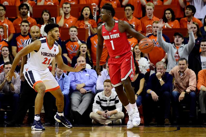 Jae'Sean Tate of the Ohio State Buckeyes dribbles the ball against Isaiah Wilkins of the Virginia Cavaliers during a game November 30, 2016. (Getty)