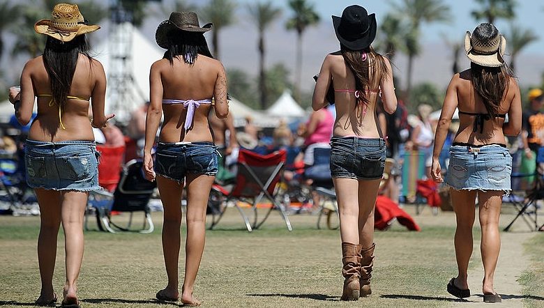 Girls at a summertime, country music festival.