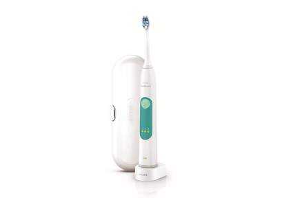 White and dark teal electric toothbrush with charging station and white case