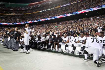 Oakland Raiders Offensive Line Sits; Washington Redskins Kneel, Link Arms During National Anthem