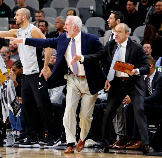 ettore messina on bench with gregg popovich