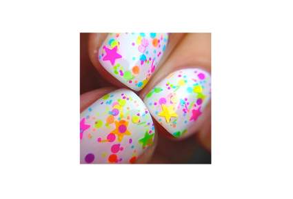 White nails with brightly colored star glitter