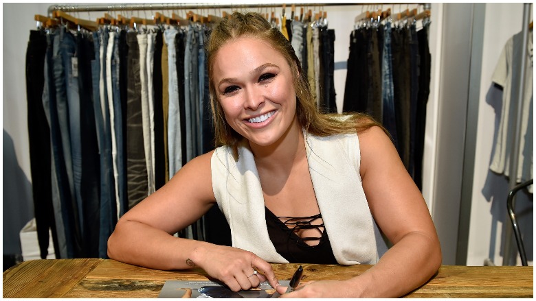 Ronda Rousey signing an autograph
