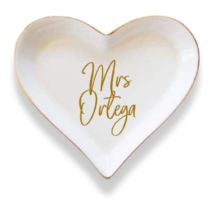 heart shaped white ceramic dish that reads "Mrs. Ortega"