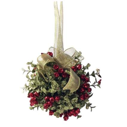 Christmas ball with gold ribbon and red berries