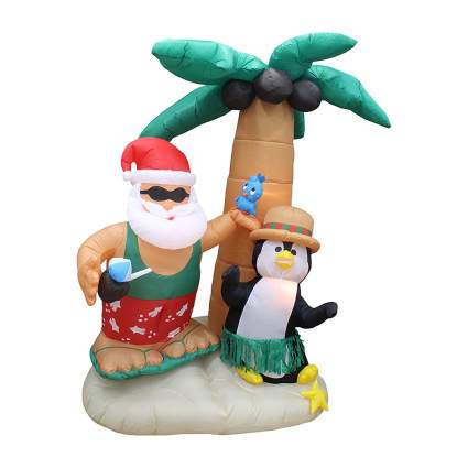 Santa with penguin and palm tree blow up decoration