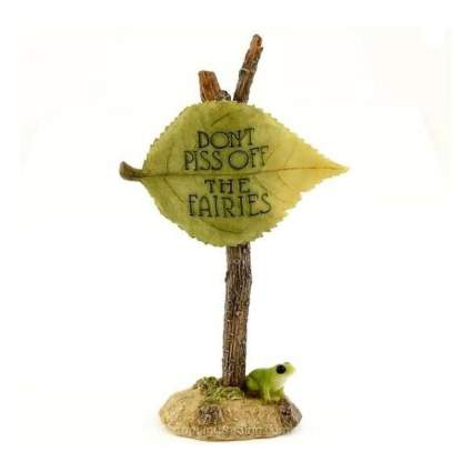 small resin garden sign that reads "don't piss off the fairies"
