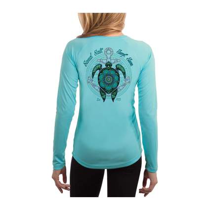 woman in blue turtle shirt