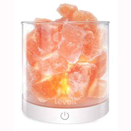 himalayan salt lamp in glass container