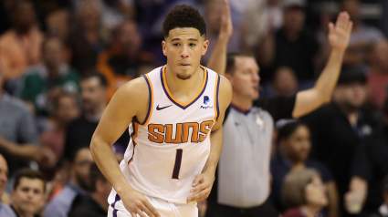 WATCH: Suns’ Devin Booker Suffers Scary Ankle Injury, Carried Off Court