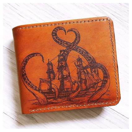 Brown leather billfold with kraken image