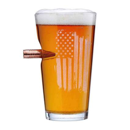 Beer glass with bullet in it