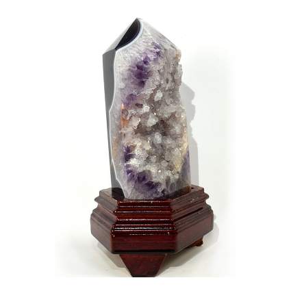Amethyst crystal with geode inside of it