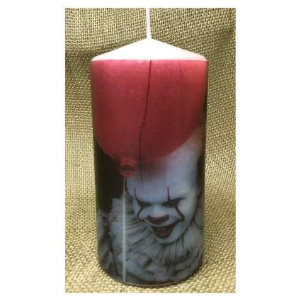 Pillar candle with Pennywise the clown