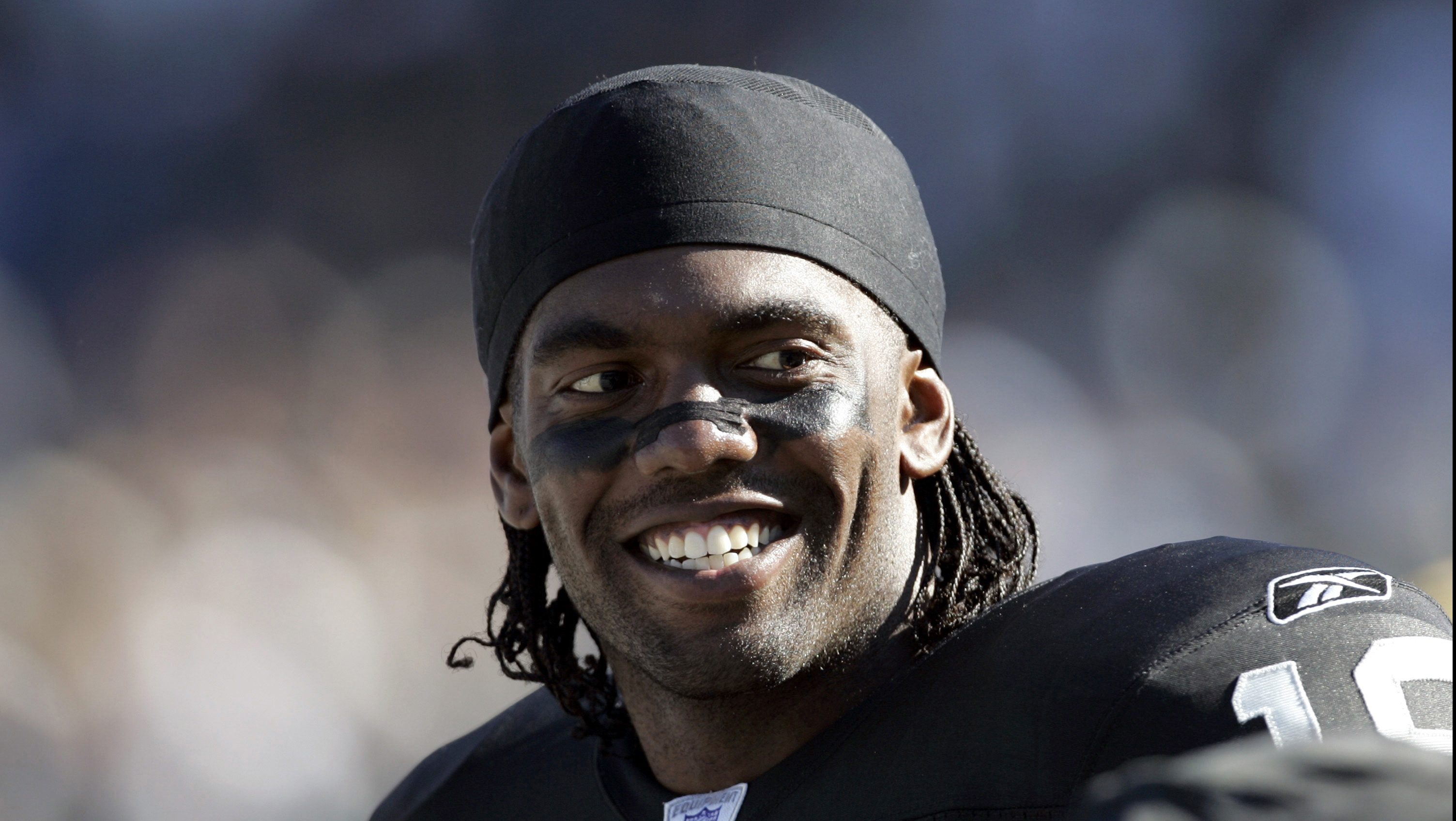 Wide receiver Randy Moss of the Minnesota Vikings smiles as he talks