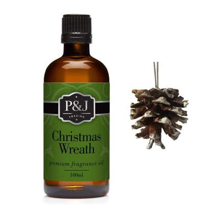Amber bottle of fragrance oil and a pinecone