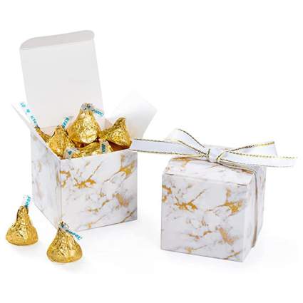 white and gold marble gift boxes with hershey kisses