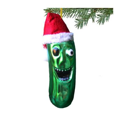 Creepy pickle ornament with zombie face and a Santa hat