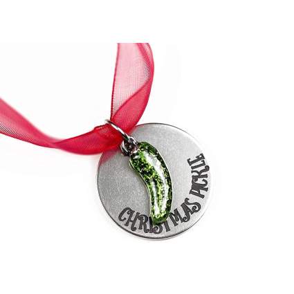 Metal pickle ornament with red ribbon