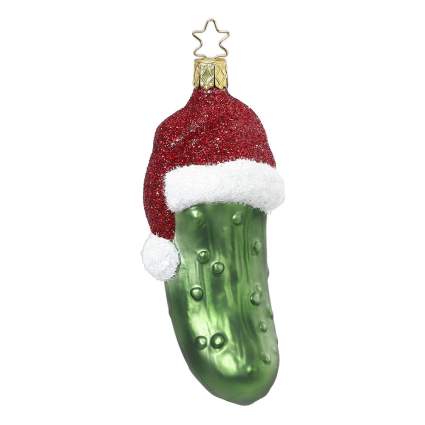 Pickle with a glittery santa hat