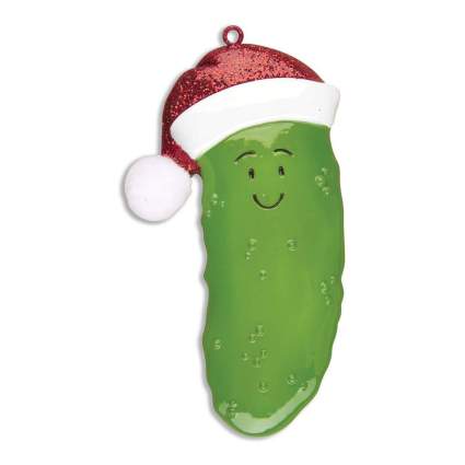 Pickle with a Santa hat and smiling face