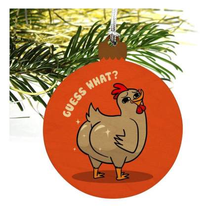 Orange ornament with chicken on it