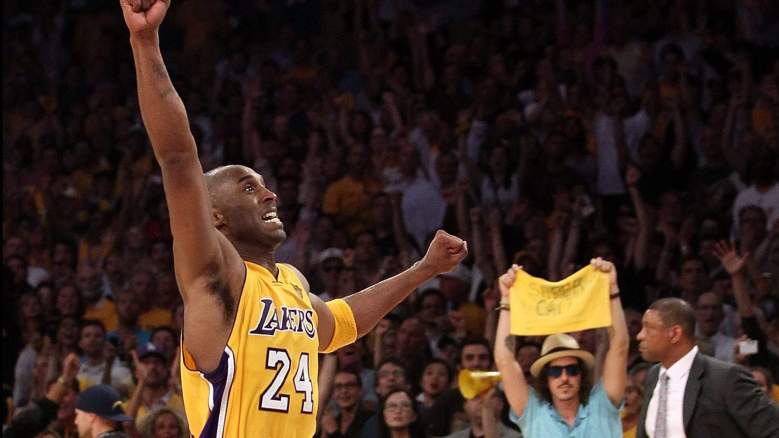 Kobe Bryant celebrates a Game 7 win in the 2010 Finals as Doc Rivers watches