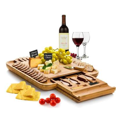 bamboo cheese board with utensils