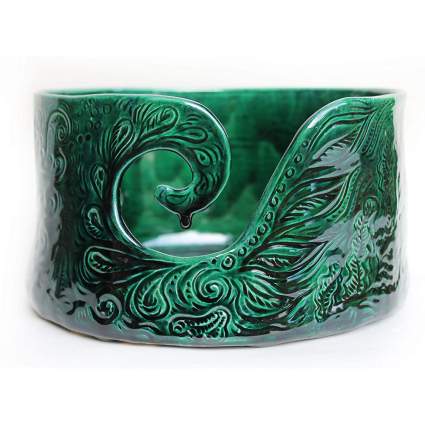 Green ceramic bowl with swirling cutout