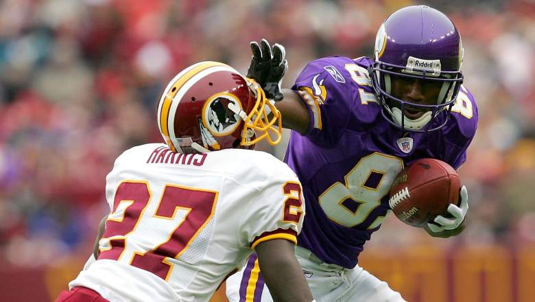 Vikings wide receiver Nate Burleson stiff arms Walt Harris of the Washington Redskins during a game on January 2, 2005 at FedEx Field in Landover, Maryland.